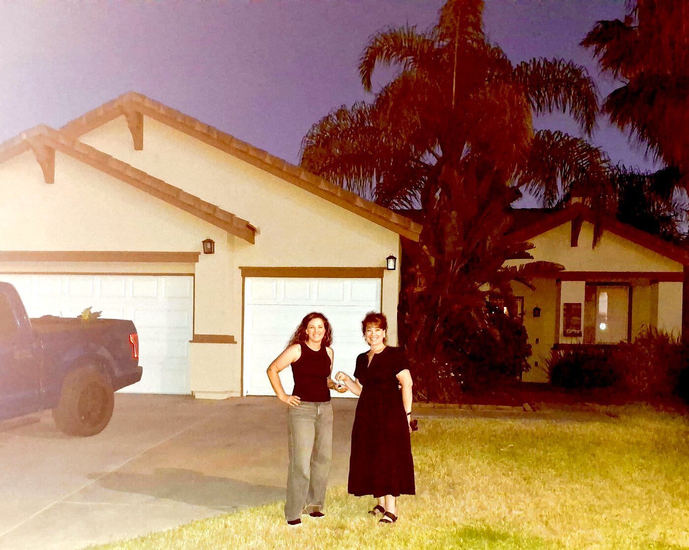 Patti McCormick handing keys to the Fleming family at their new Menifee home